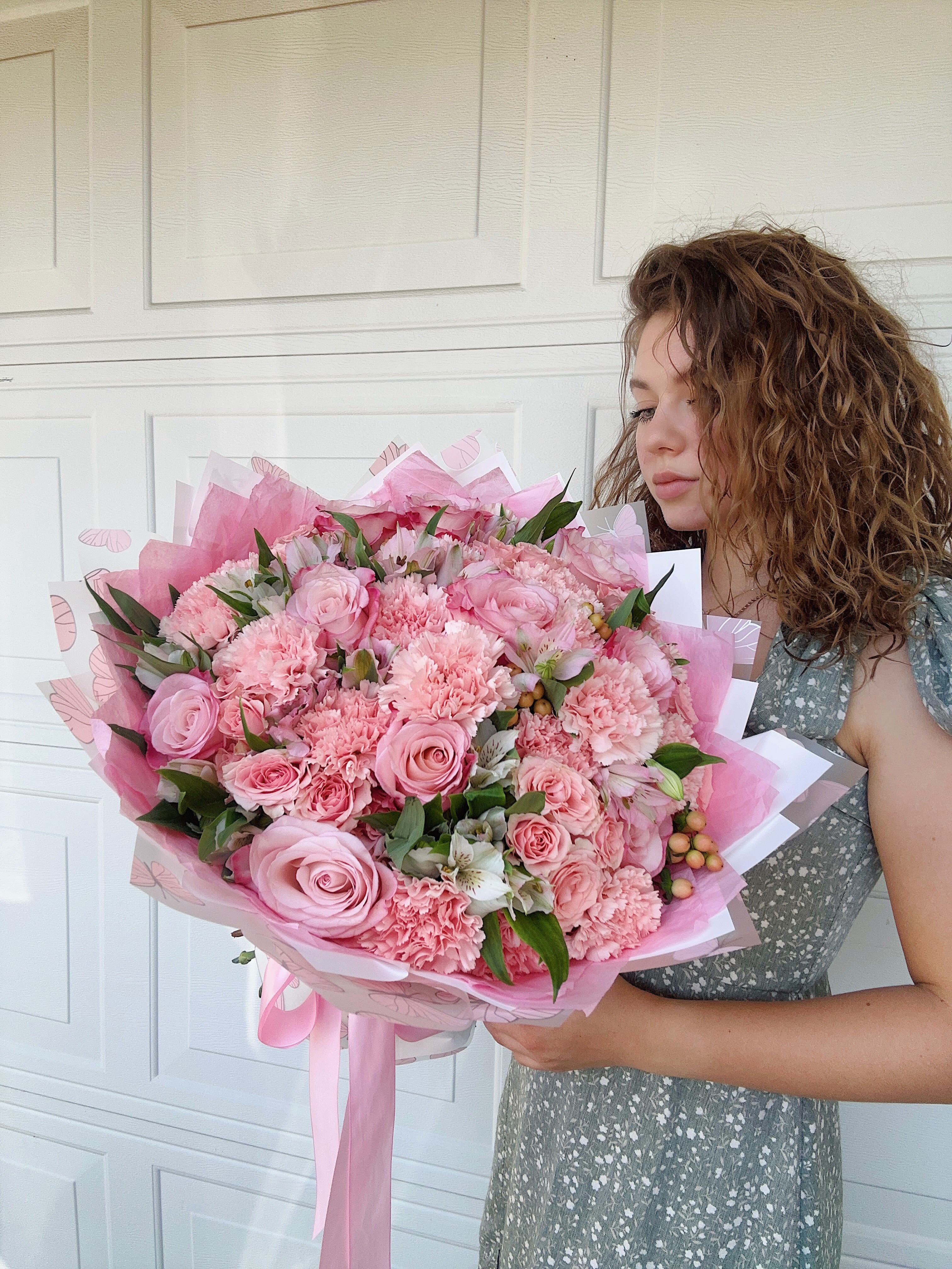 Large pink bouquet of roses, carnations, and alstroemeria