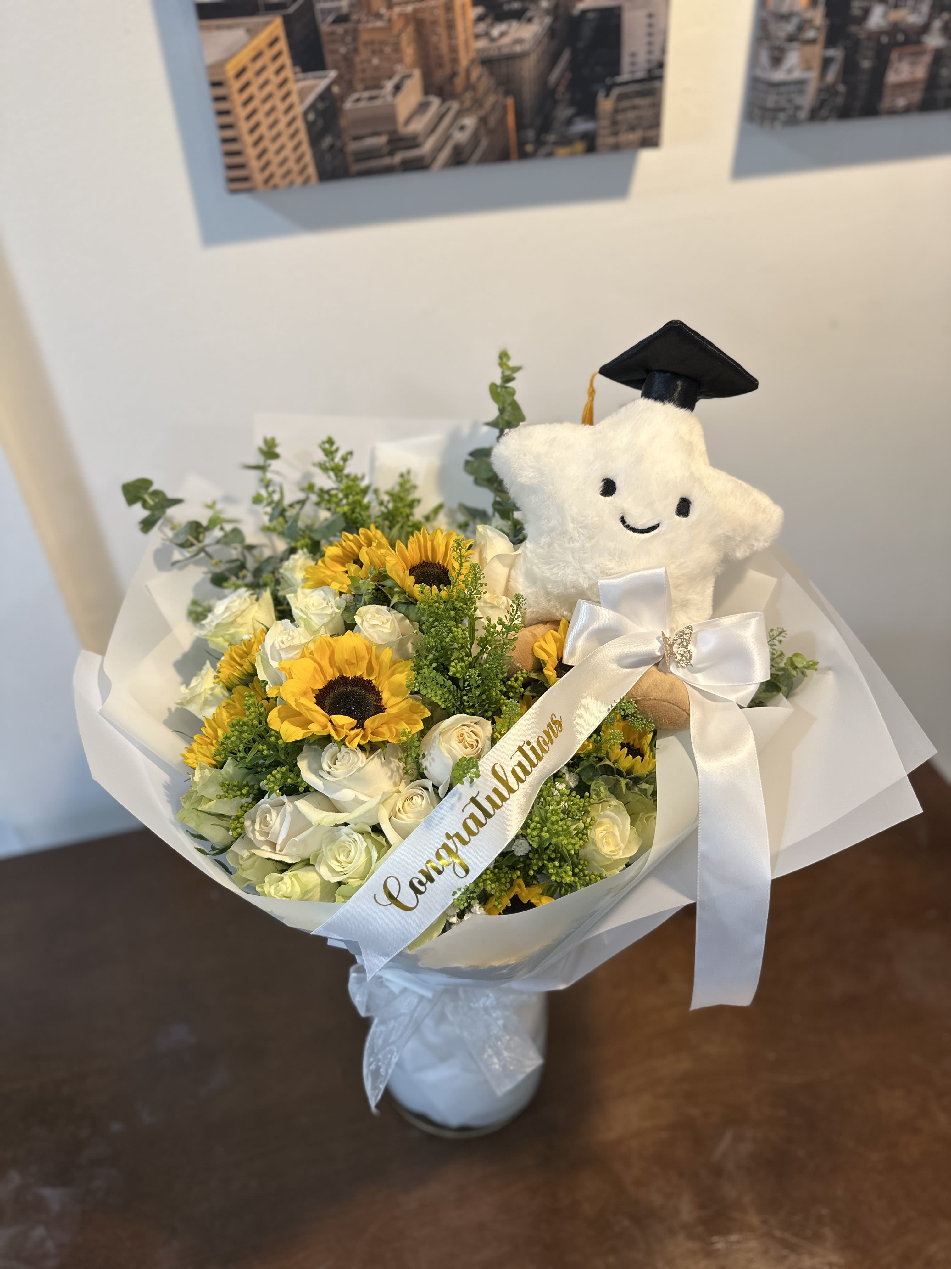 Sunflower and white rose bouquet with a graduation plush and ribbon