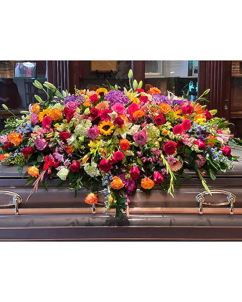 Large casket spray with mixed colorful flowers