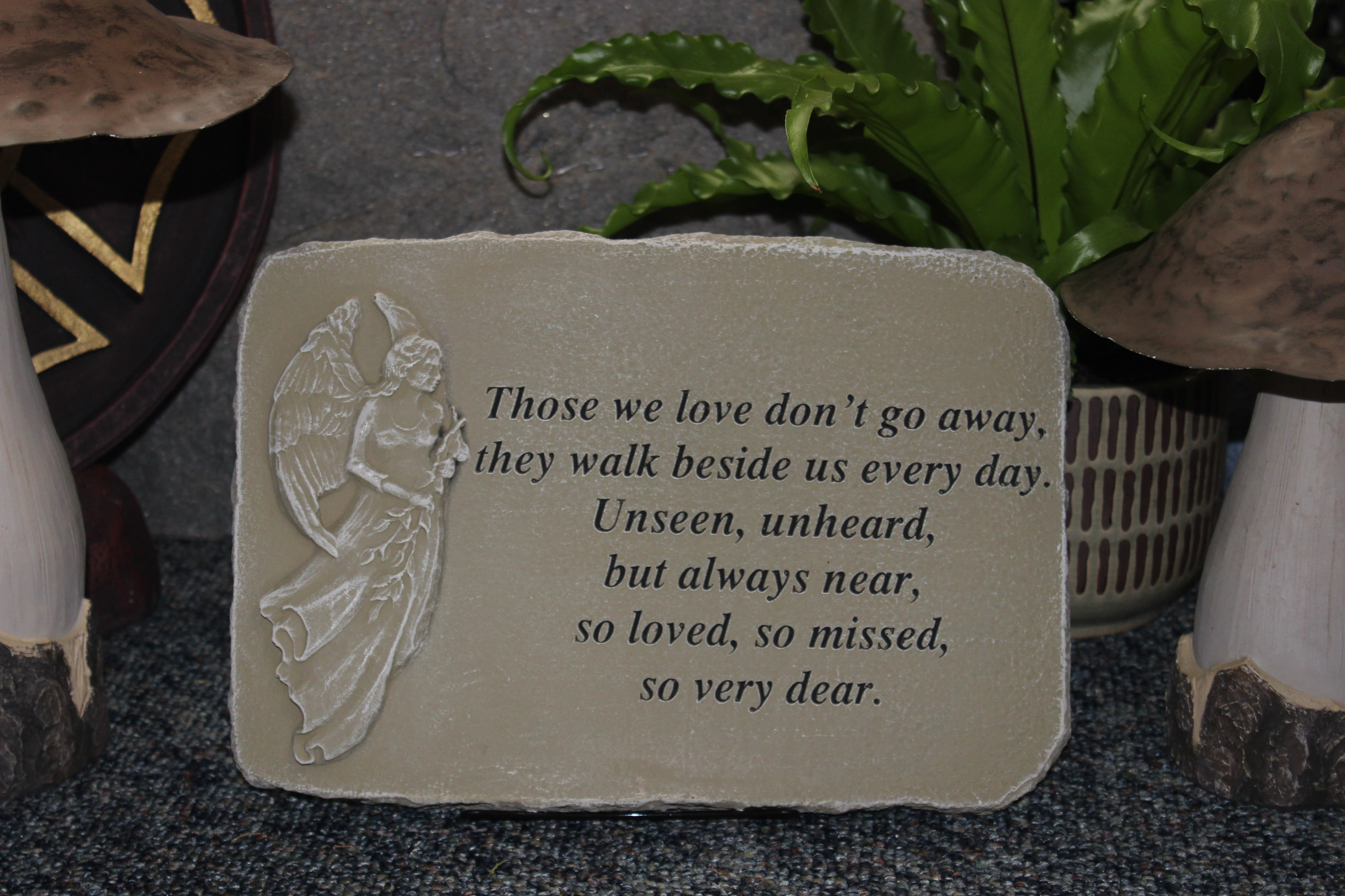 Memorial plaque with an angel and sympathy verse