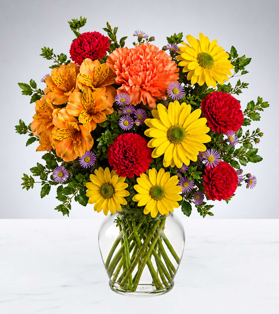 Colorful mixed bouquet in a clear glass vase