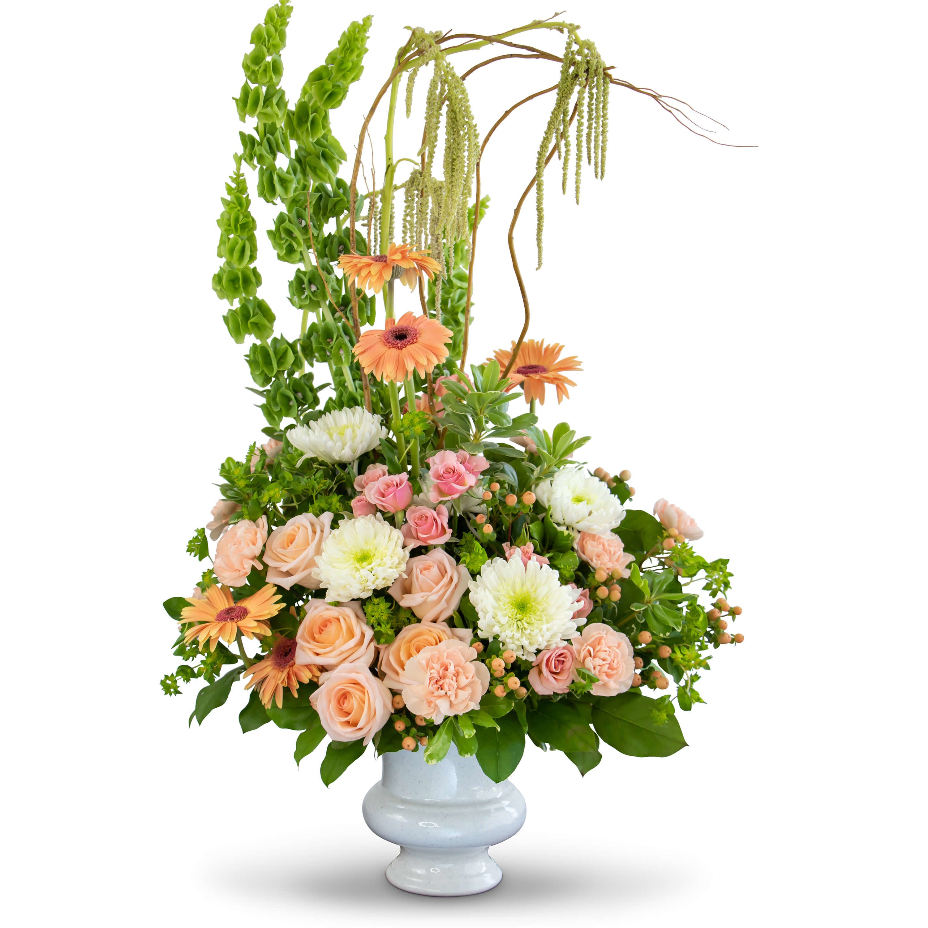 Divine Grace Tribute  - The Divine Grace Tribute will stand out as a stylish arrangement at the final services of your loved one. Roses, Chrysanthemums, Bells of Ireland, Carnations, Gerbera Daisies and Hypericum Berries are displayed in a modern design.
