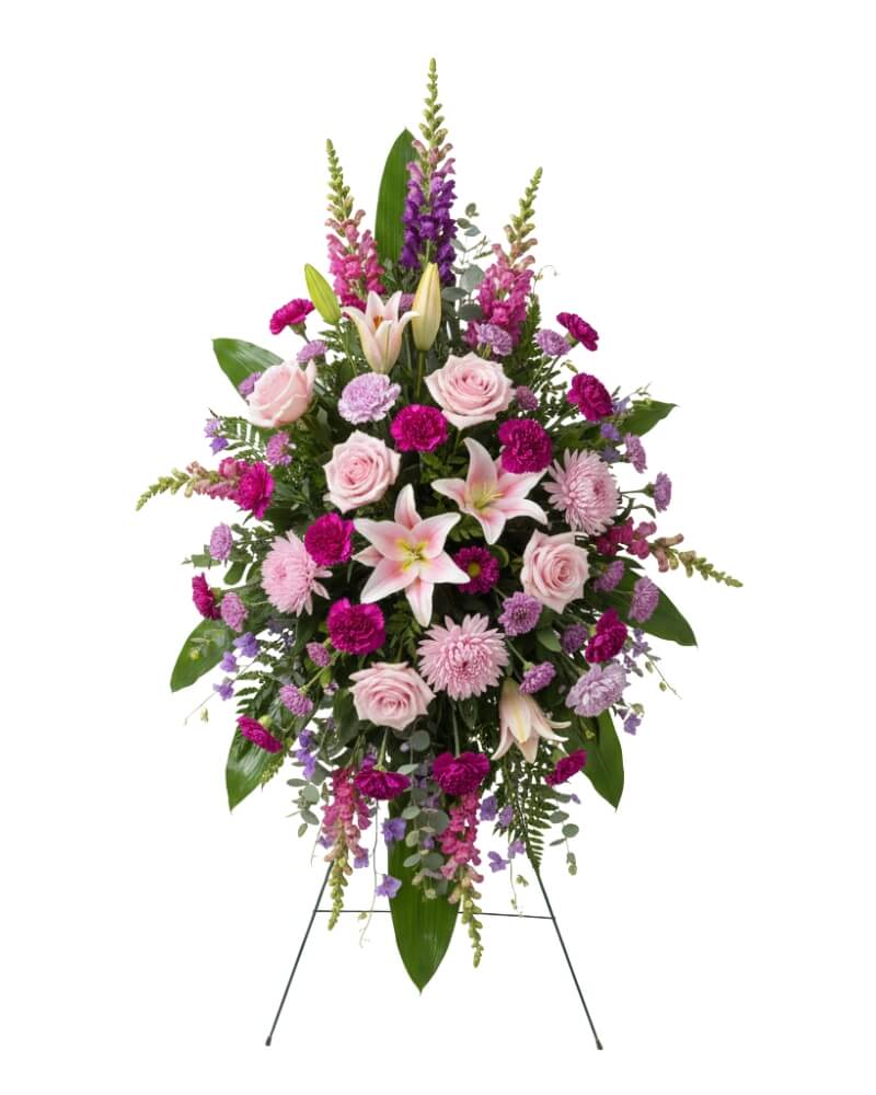 Eternal Grace Standing Spray  - A grand and soaring floral tribute presented on a traditional easel. This spray symbolizes strength and enduring memory, using height and vibrant color to celebrate a life well-lived.