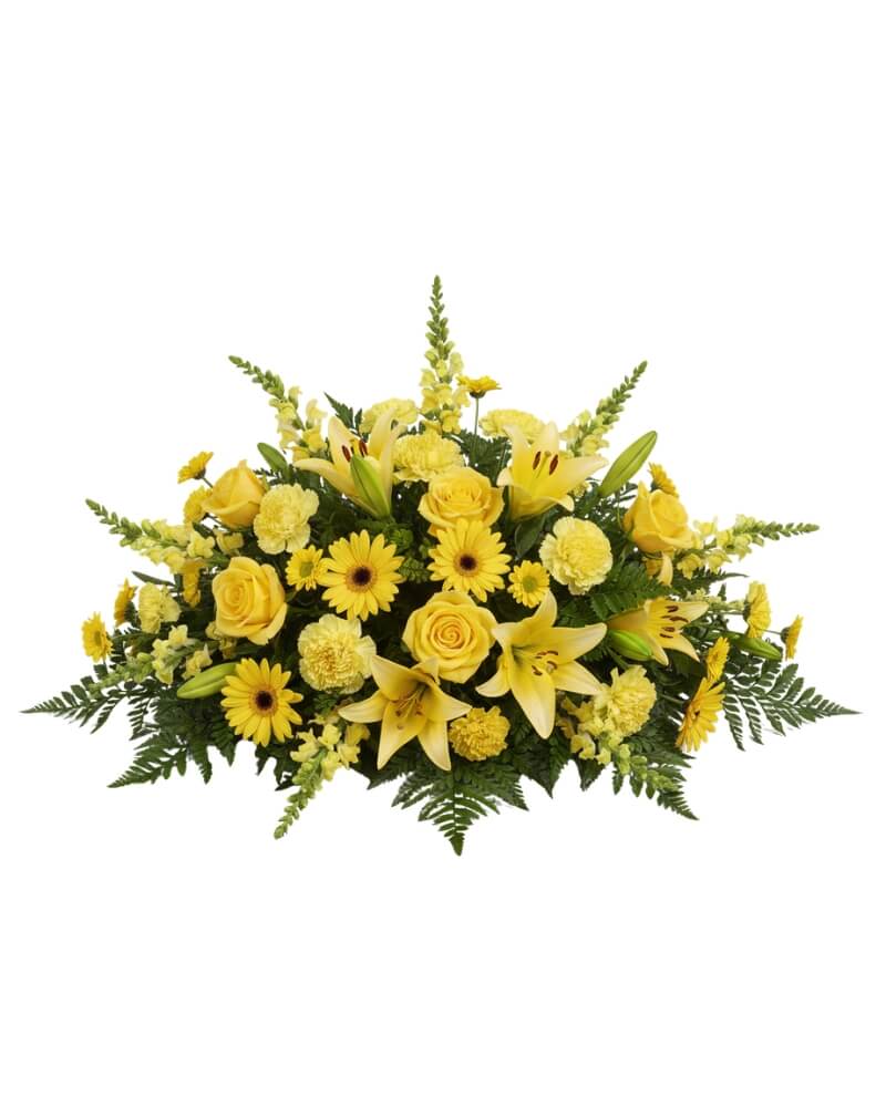 Eternal Sunshine Casket Spray  - A majestic and sprawling tribute designed to rest gracefully atop a casket. This lush arrangement features a radiant blend of golden roses, lilies, and snapdragons, offering a warm and hopeful farewell.