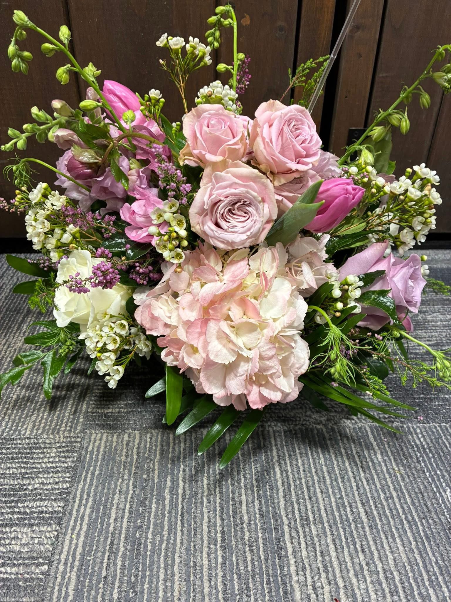 Pink and white floral arrangement with roses and hydrangea