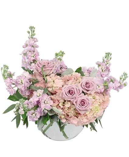 Pink roses and hydrangeas in a white vase