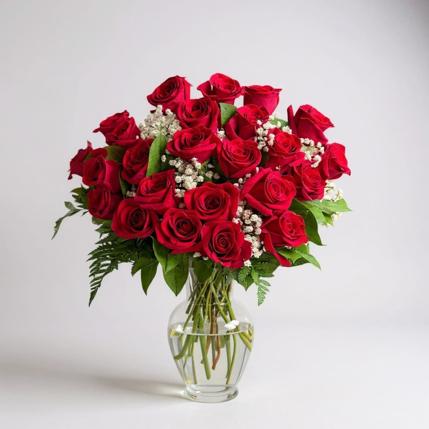 Bouquet of red roses in a clear glass vase