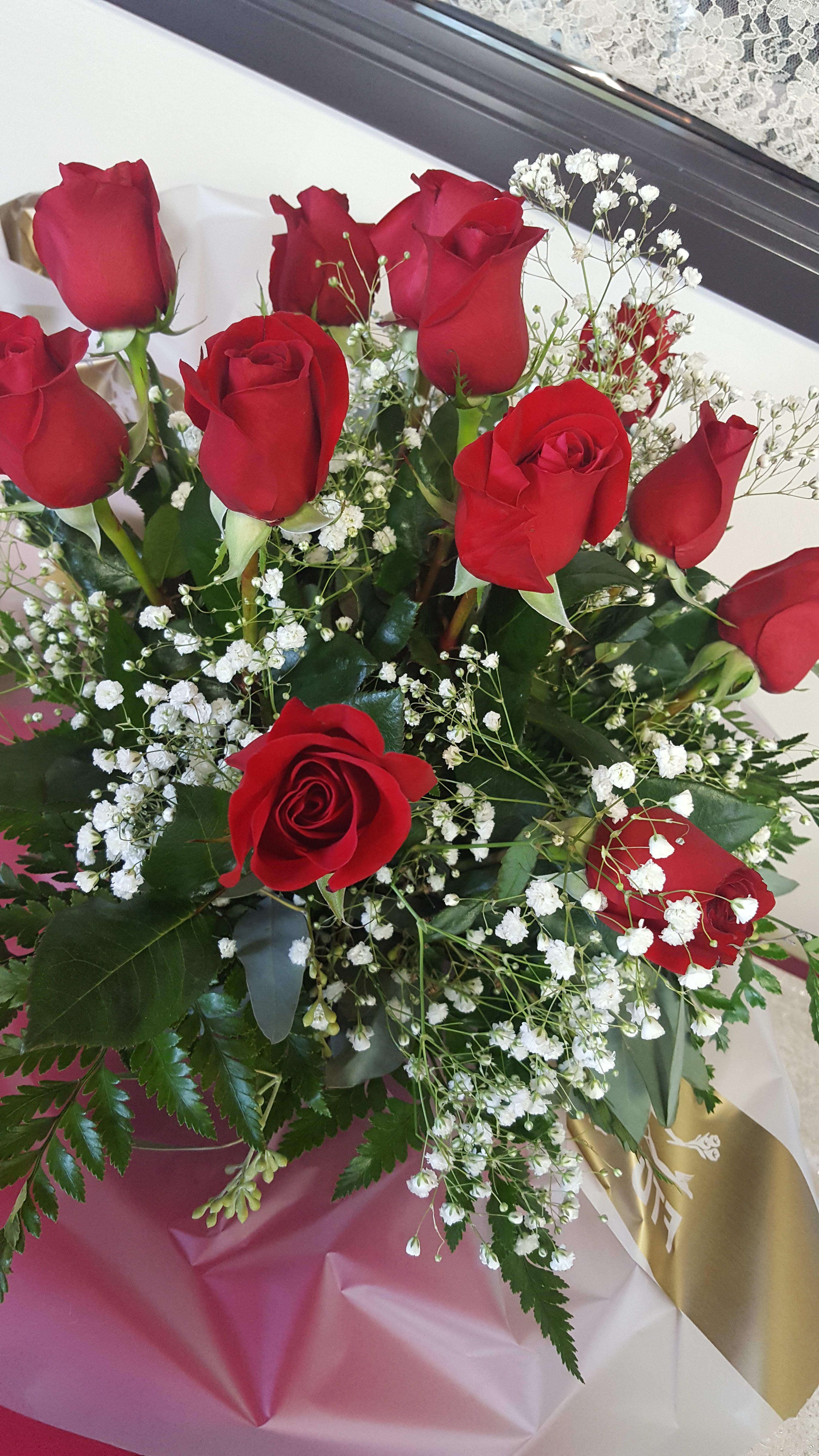 Bouquet of red roses with white baby's breath