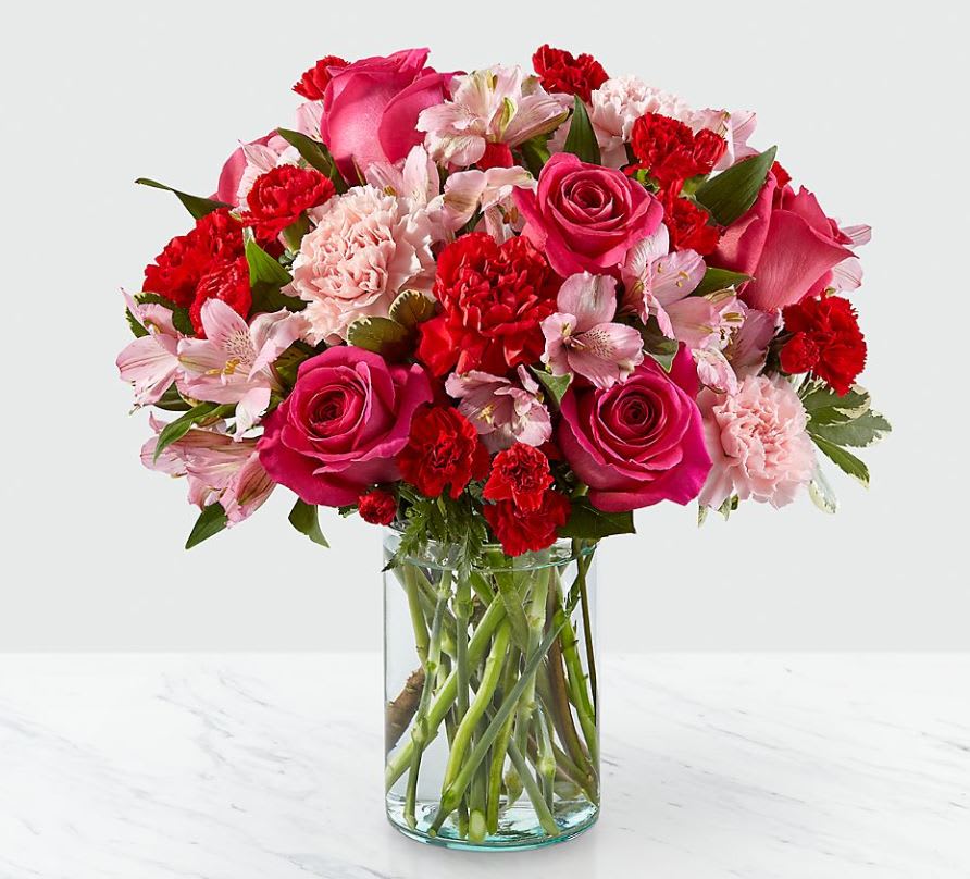  You're Precious Bouquet - You're Precious Bouquet is full of sweet sentiment for your favorite person. Hot pink roses, red carnations, pink alstroemeria, and pale pink carnations come together in a clear glass vase to make any room feel beautiful and light. From special birthdays to simply just because, this arrangement is a stunning gift to give your loved ones for every occasion.