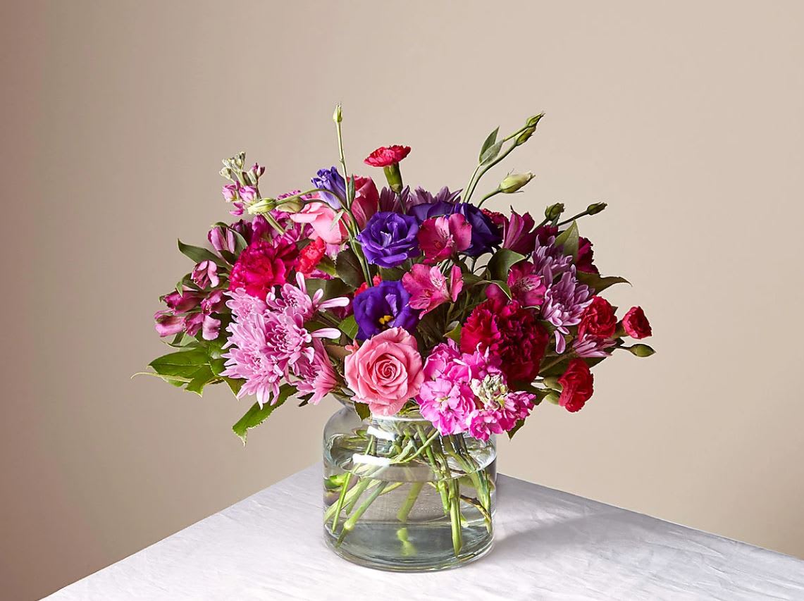Sweet Thing Bouquet - The Good Bouquet is about 15"H by 15"W. Comes in a clear glass vase. For long–lasting blooms replace water and trim stems daily. The bouquet pictured reflects our original design for this product. While we always try to follow the color palette, we may replace stems to deliver the freshest bouquet possible, and we may sometimes need to use a different vase.