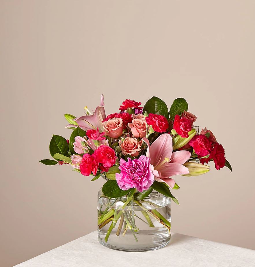 Give Me Butterflies Bouquet - The Better Bouquet is about 13"H by 15"W. Comes in a clear glass vase. For long–lasting blooms replace water and trim stems daily. The bouquet pictured reflects our original design for this product. While we always try to follow the color palette, we may replace stems to deliver the freshest bouquet possible, and we may sometimes need to use a different vase.