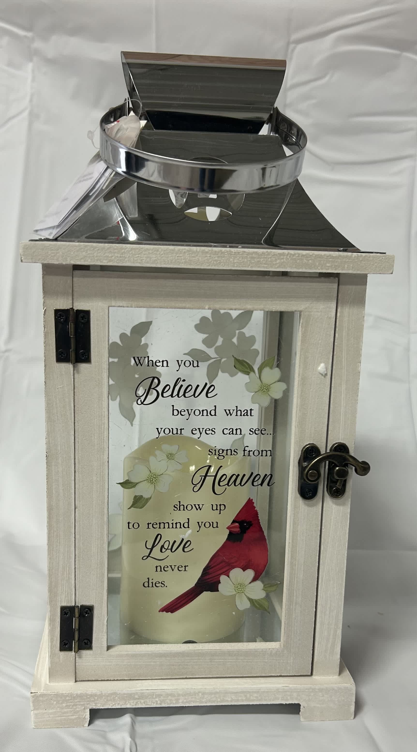 Wooden memorial lantern with a candle and cardinal design