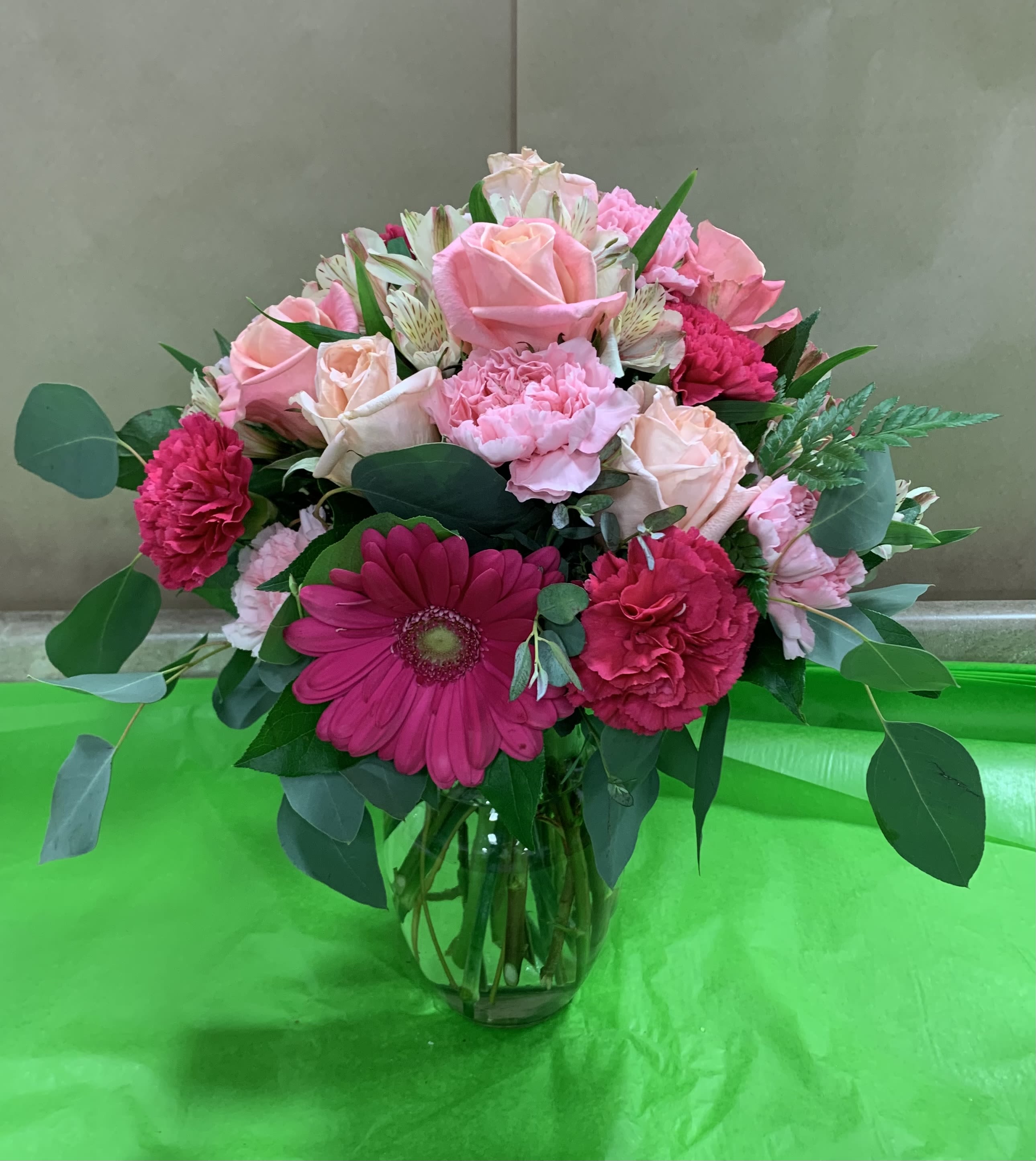 Pink mixed bouquet in a clear glass vase