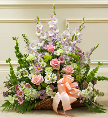 Thoughts and Prayers Fireside Basket - Pastel - Product ID: 91398   This touching tribute beautifully conveys your sympathy and support with elegant hand-arranged pastel blooms. Pastel-hued roses, gladiolas, Bells of Ireland, stock, carnations, button poms, daisy poms and more, hand-arranged by our expert florists Traditionally sent by family, friends or business associates Delivered directly to the funeral home Our florists use only the freshest flowers available so varieties and colors may vary Basket measures 21"L Measures approximately 28âH x 28âL
