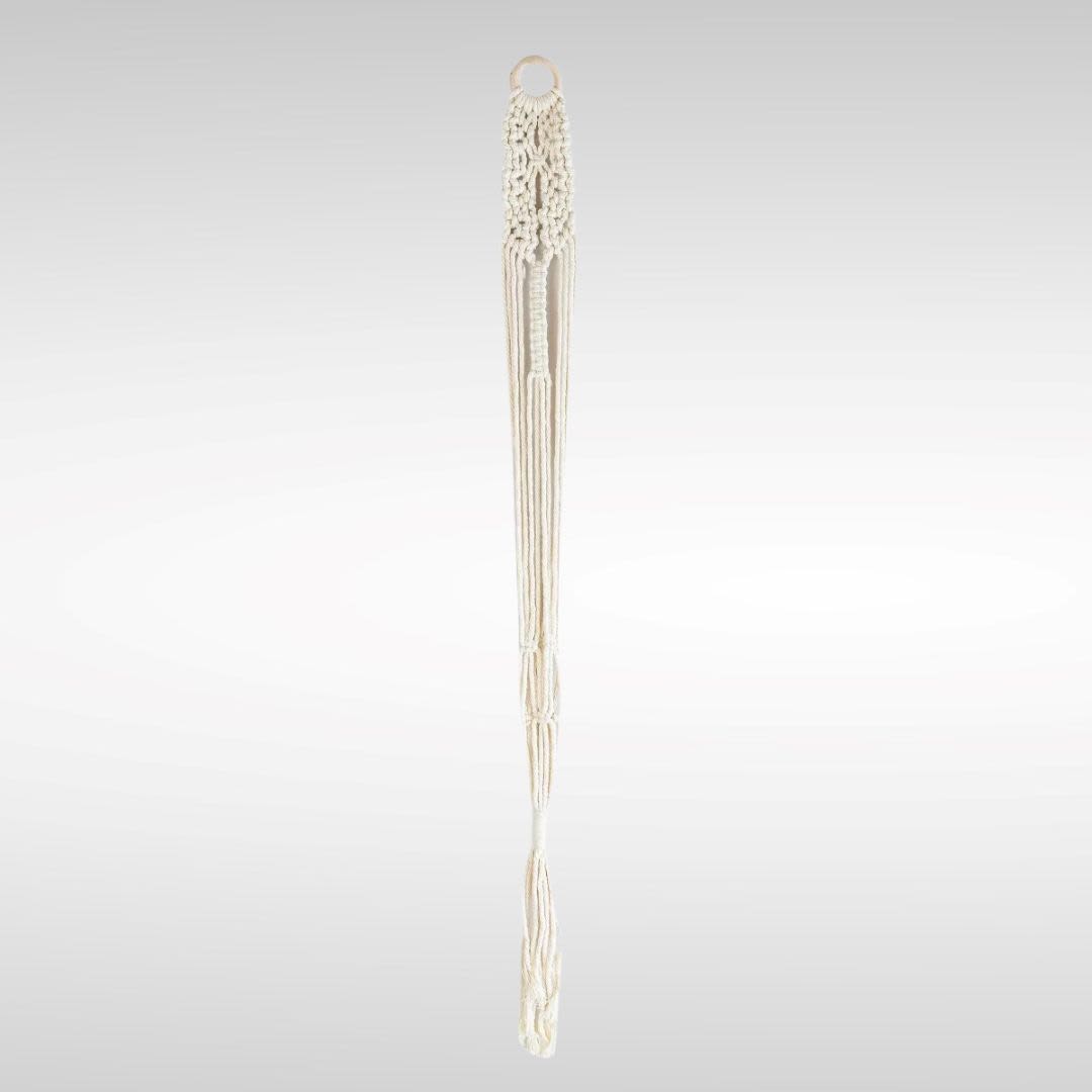 Cream macramé wall hanging with a ring top and long tassels