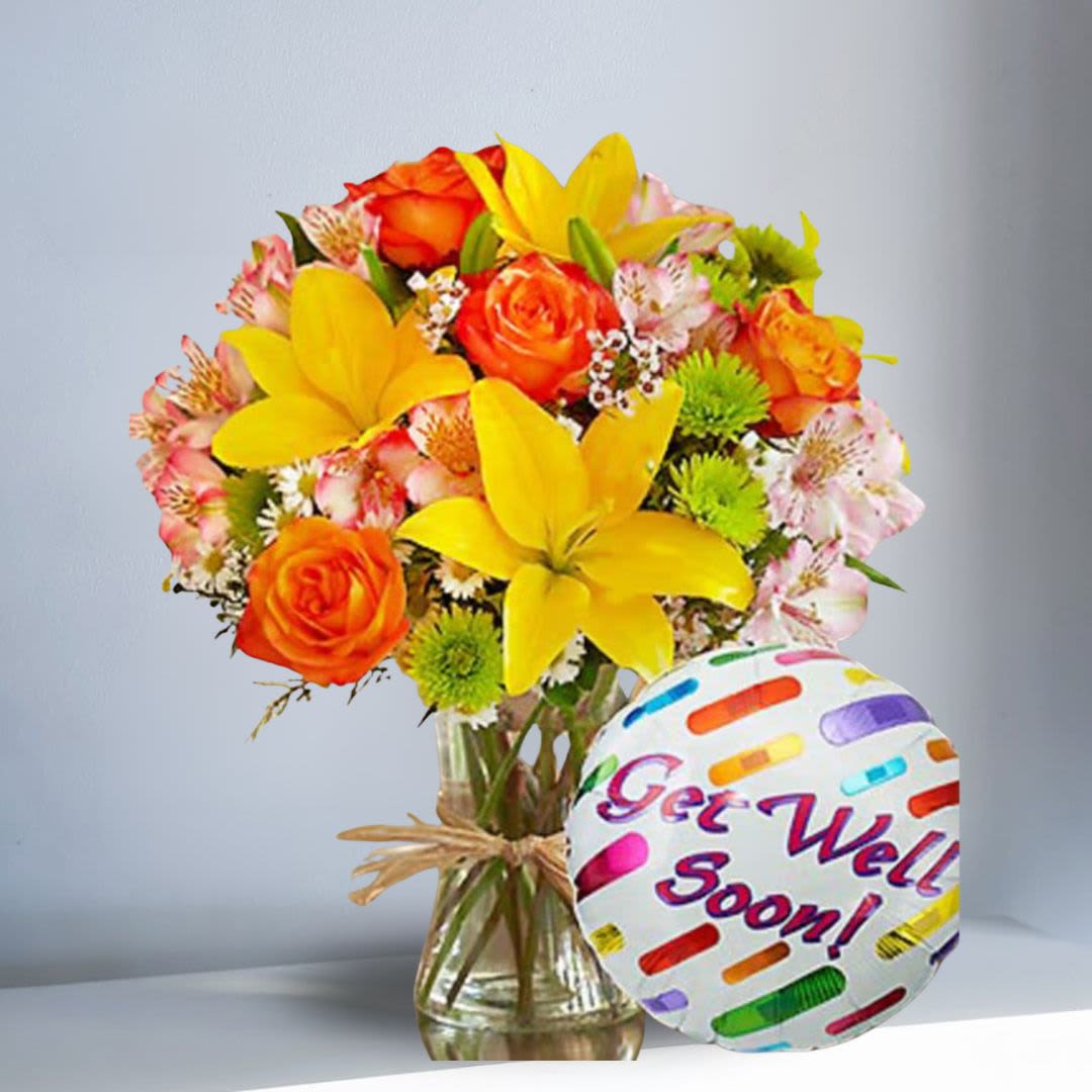 Fields of Europe Get Well with Mylar - Just what the doctor ordered -- inspired by the spectrum of color found in the rolling fields of Europe, our florists designed this gathering of fresh roses, lilies, alstroemeria, poms, and more inside a stylish clear glass vase tied with raffia, as a nod to rustic European style. Includes a "Get Well" Mylar balloon.