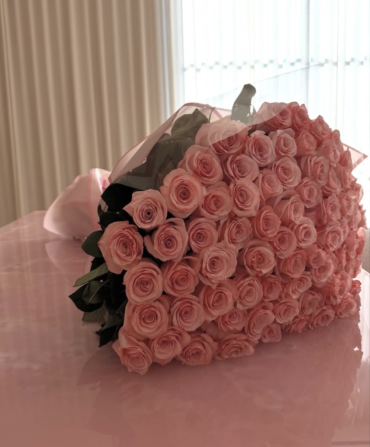 The Timeless Grand One Hundred Rose Wrap - Make a breathtaking statement with our Hundred Rose Wrap — a luxurious, hand-tied bouquet designed to wow at first sight. Featuring 100 premium long-stem roses, this dramatic wrap is expertly arranged and finished in elegant wrapping for a modern, upscale presentation.  Choose from classic red, soft romantic pink, or a stunning mix of red and pink to perfectly match the moment. Whether you’re celebrating an unforgettable anniversary, a grand romantic gesture, or a milestone worthy of admiration, this bouquet speaks volumes without saying a word.  Bold. Romantic. Unforgettable. The Hundred Rose Wrap is the ultimate expression of love and elegance. 
