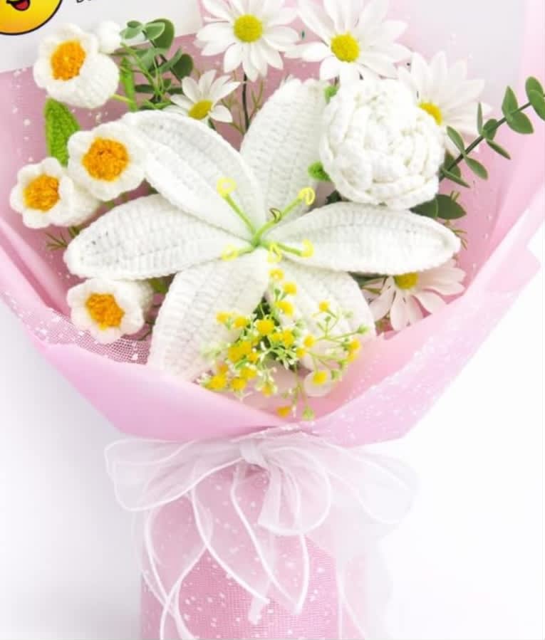 Pink-wrapped bouquet with white daisies and a large white lily