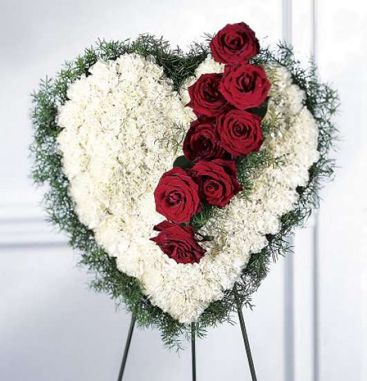 Heart-shaped floral standing spray with red roses and white flowers