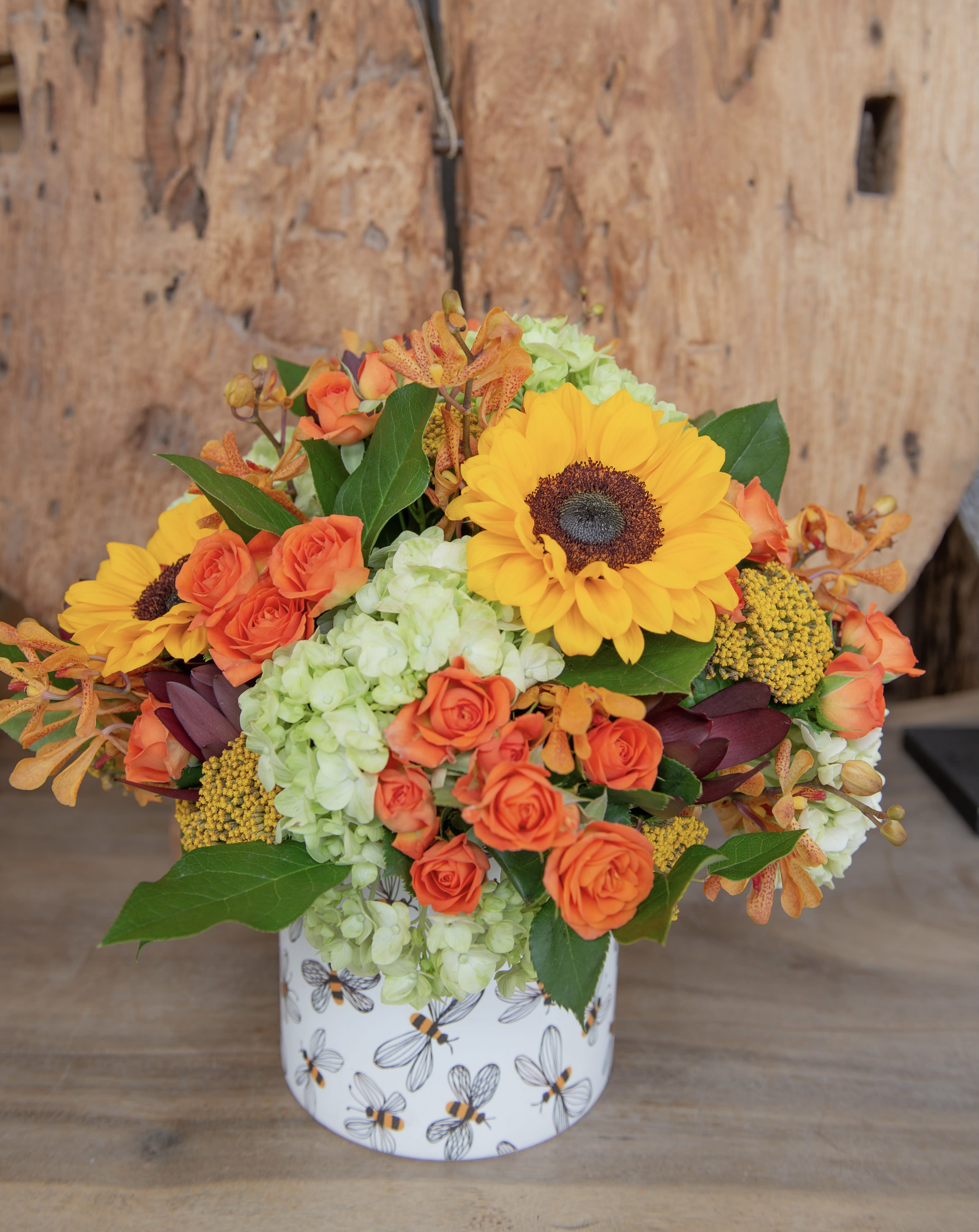 Honey Bees - Say hello to autumn with our honey bee ceramic vase filled with fall inspired blooms. 