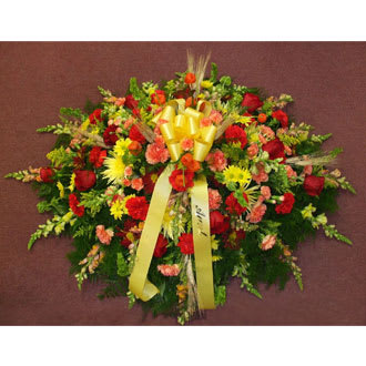 Autumn Splendor Casket Spray - A very special casket spray with its array of roses carnations daisies snap dragon wheat and spider mums adds a loving gesture to the service.
