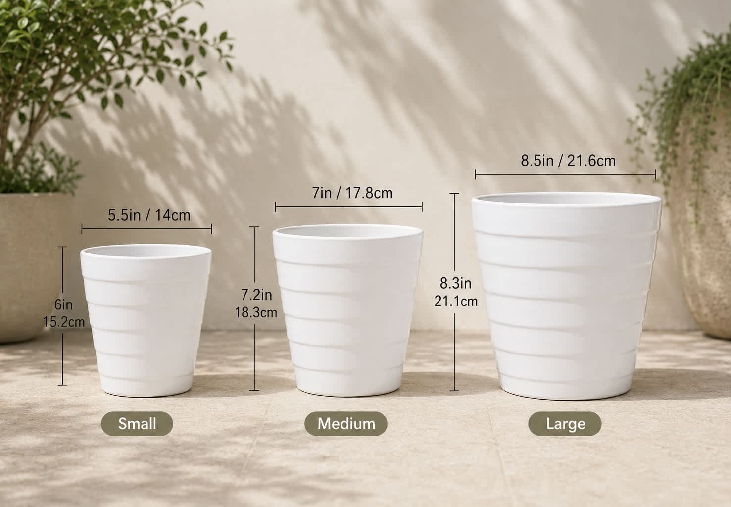 Three white tapered plant pots labeled small, medium, and large