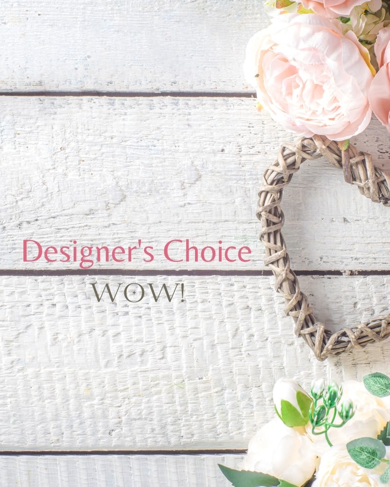 Blush and white flowers with a woven heart on white wooden boards and text reading Designer's Choice WOW.