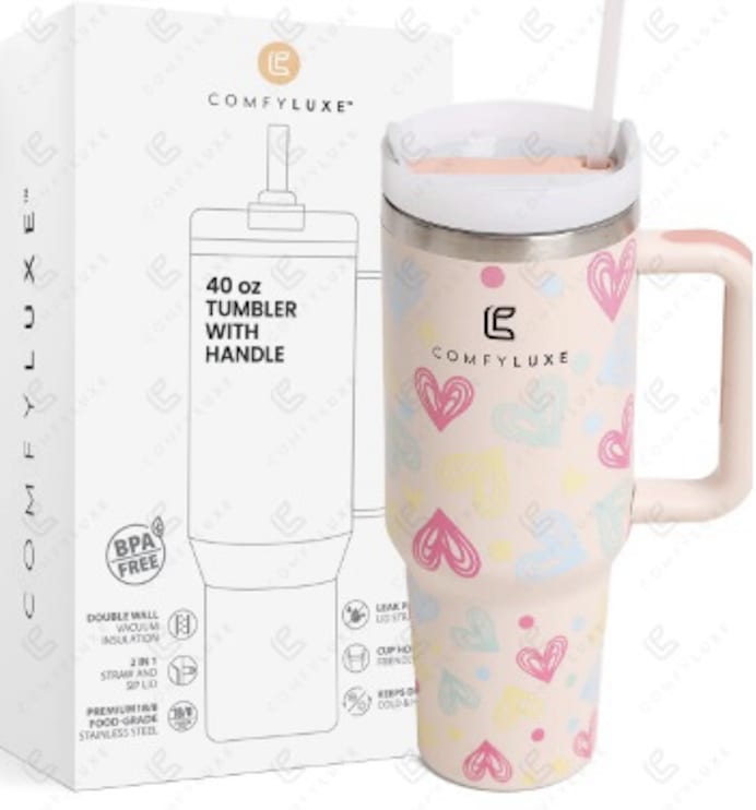 Pink heart-pattern 40 oz tumbler with handle beside branded box