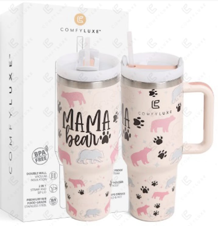 Set of two pink "Mama Bear" insulated tumblers with bear and paw print designs in front of a branded box