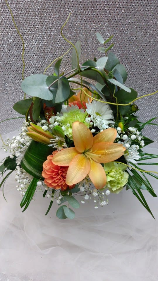 Mixed bouquet with orange lilies, white daisies, and greenery