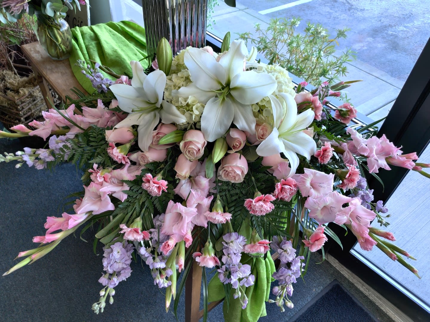 Large pink and white floral arrangement with lilies and roses