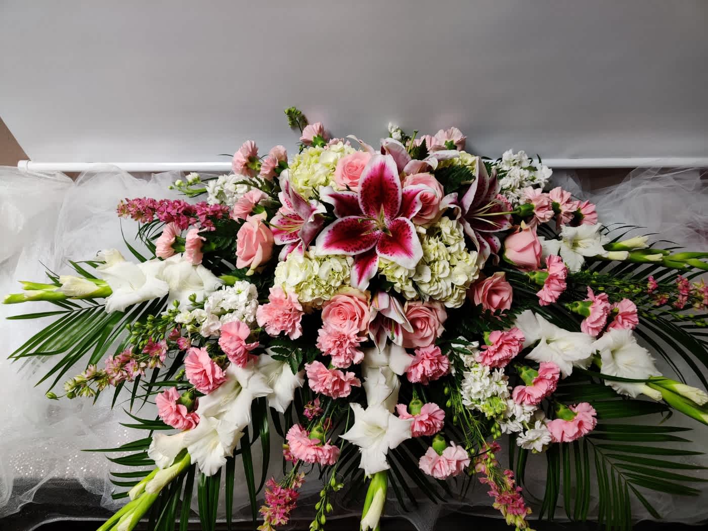 Large pink and white floral spray with lilies and roses