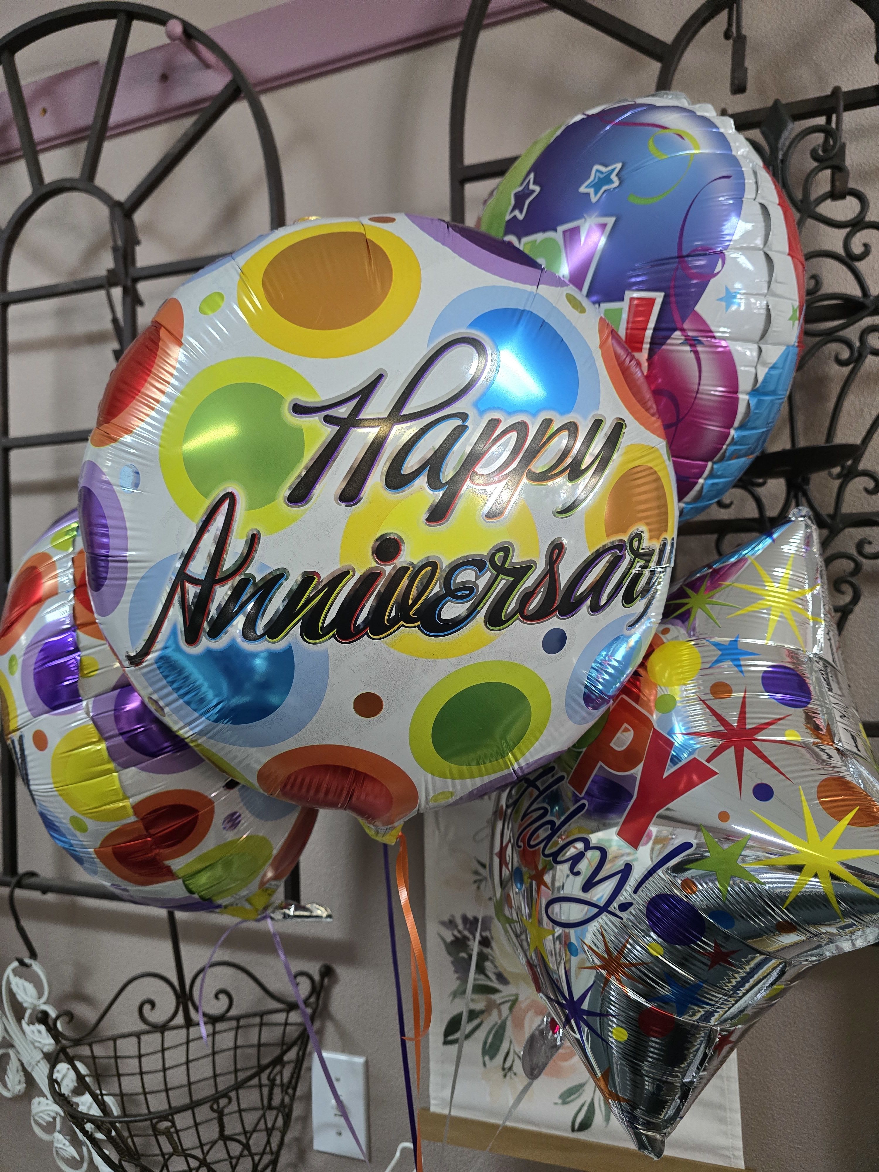 Colorful birthday balloons with "Happy Anniversary" text