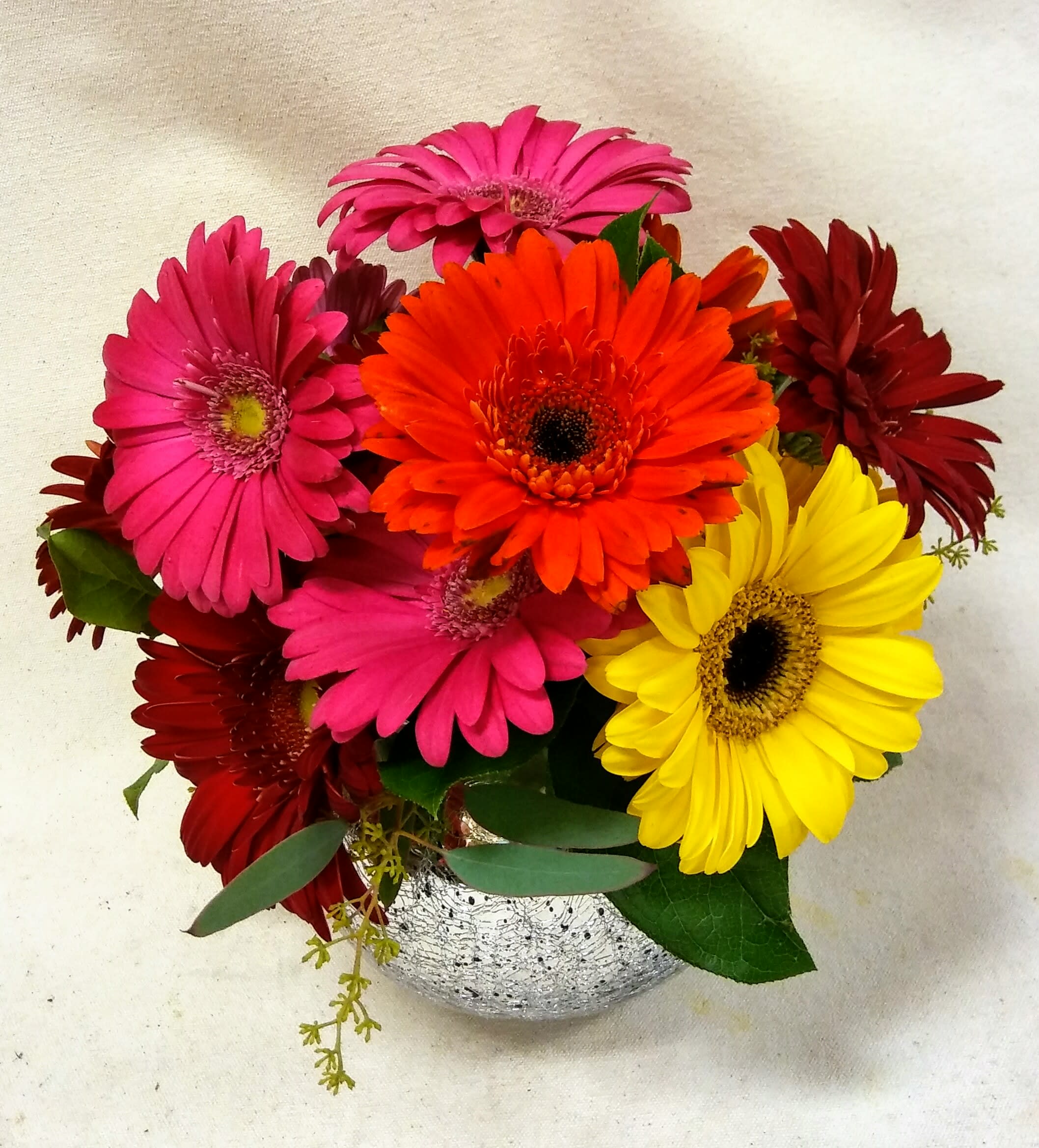 "Smile!" Bouquet - Colorful mixed gerbera daisies are playfully arranged in a glass bubble bowl. Sure to bring a smile to anyone's face! 