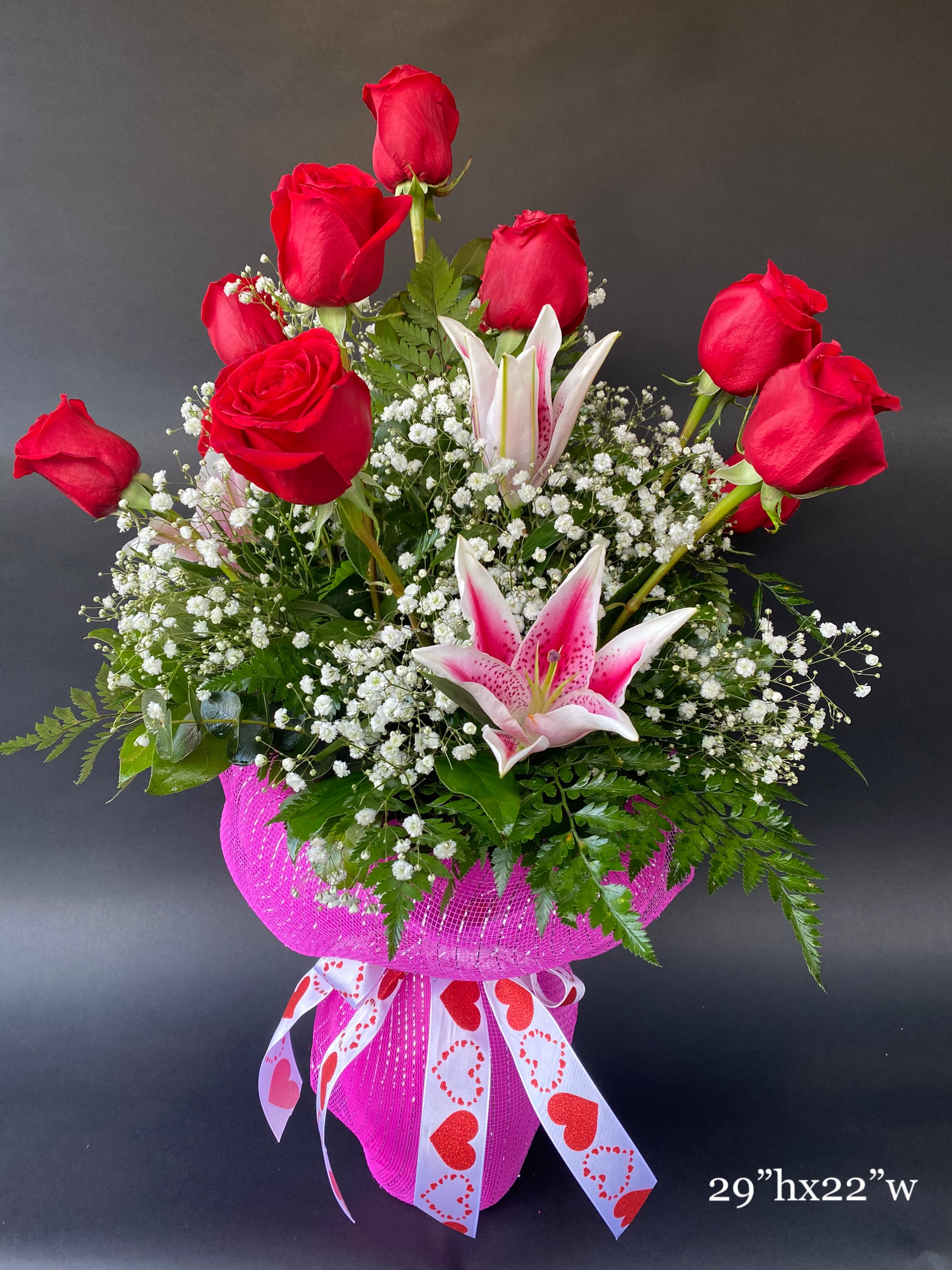 Blooming Roses With Love - Send the most extravagant 1 dozen red rose arrangement for Valentine's day, anniversary celebrations, or declarations of love. This luxury arrangement makes a big statement of "Blooming Roses With Love"