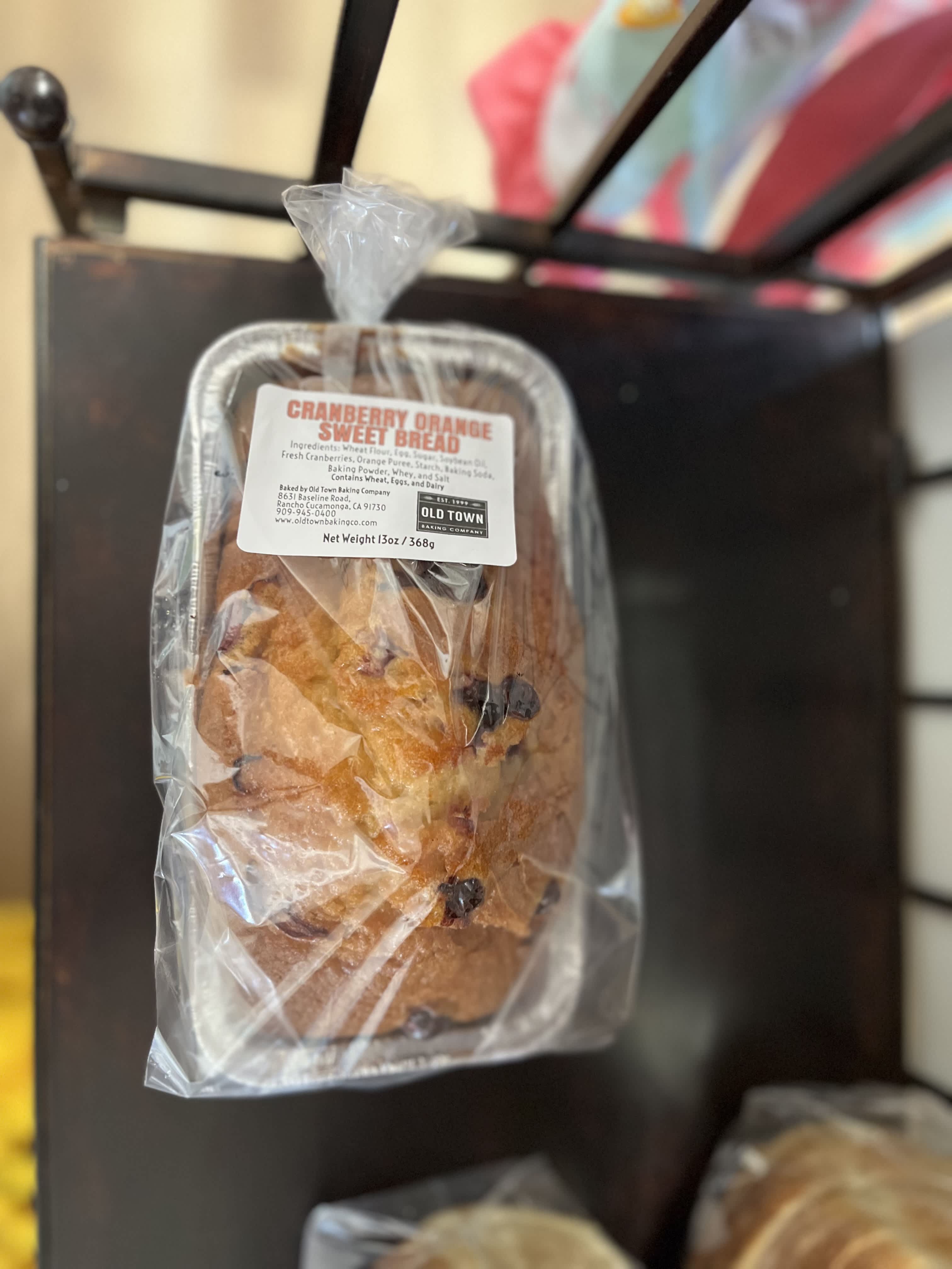 Wrapped cranberry orange sweet bread in a foil tray