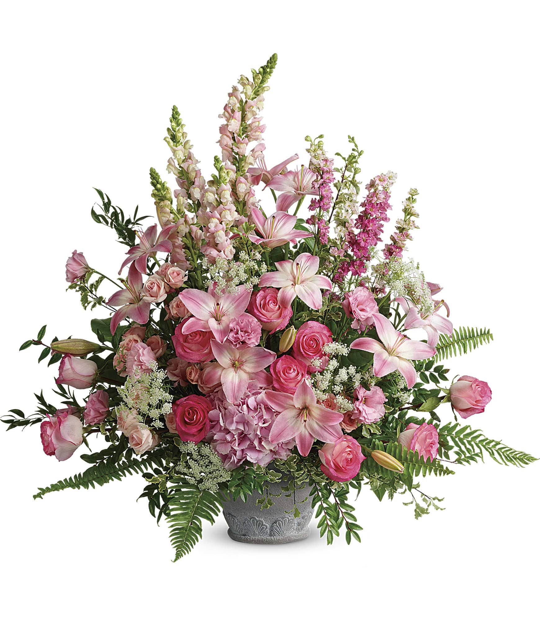 Tall pink arrangement with lilies, roses, and snapdragons in a gray ceramic urn