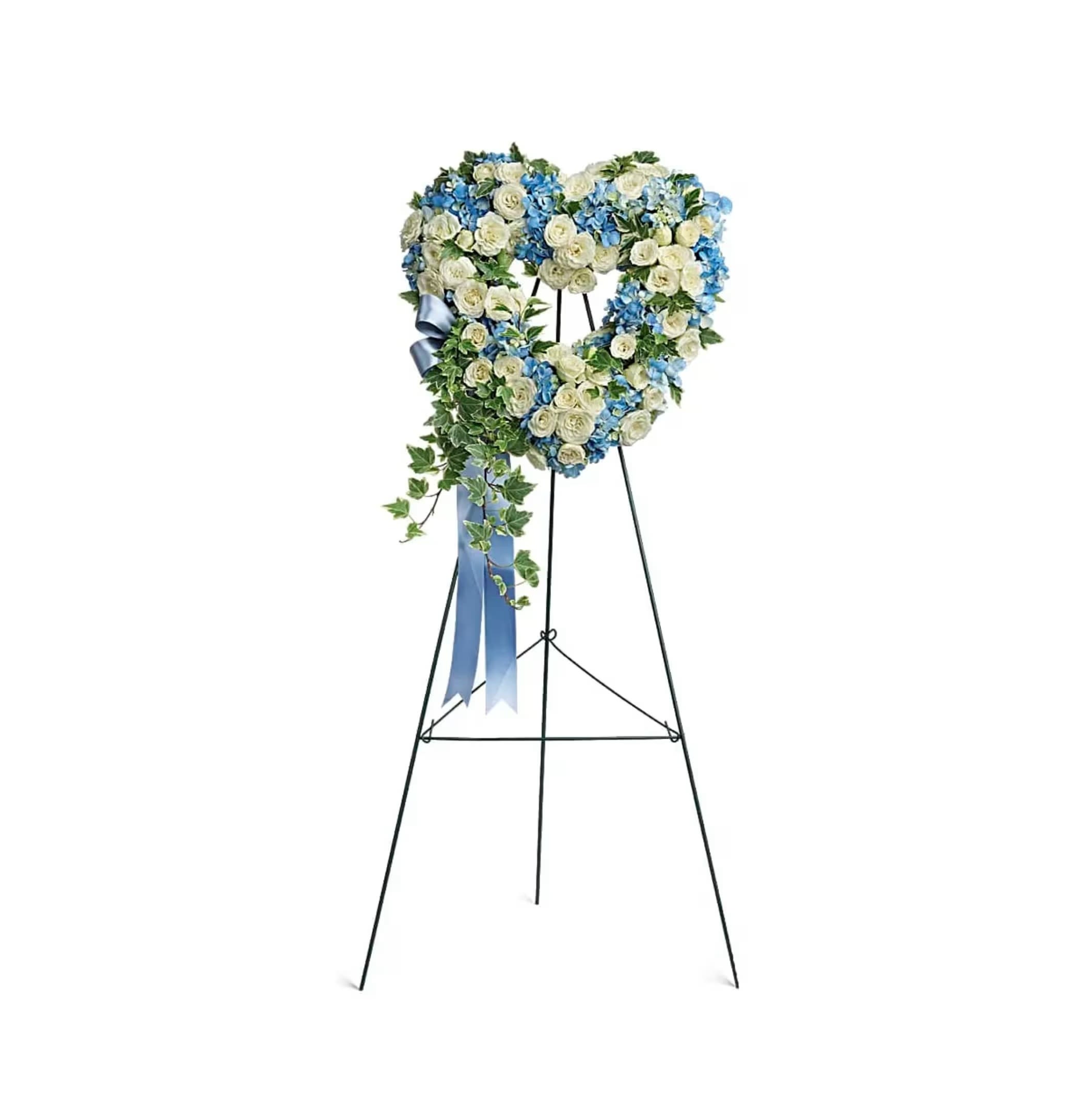 Heart-shaped blue and white standing wreath with roses and hydrangeas on a tall metal easel