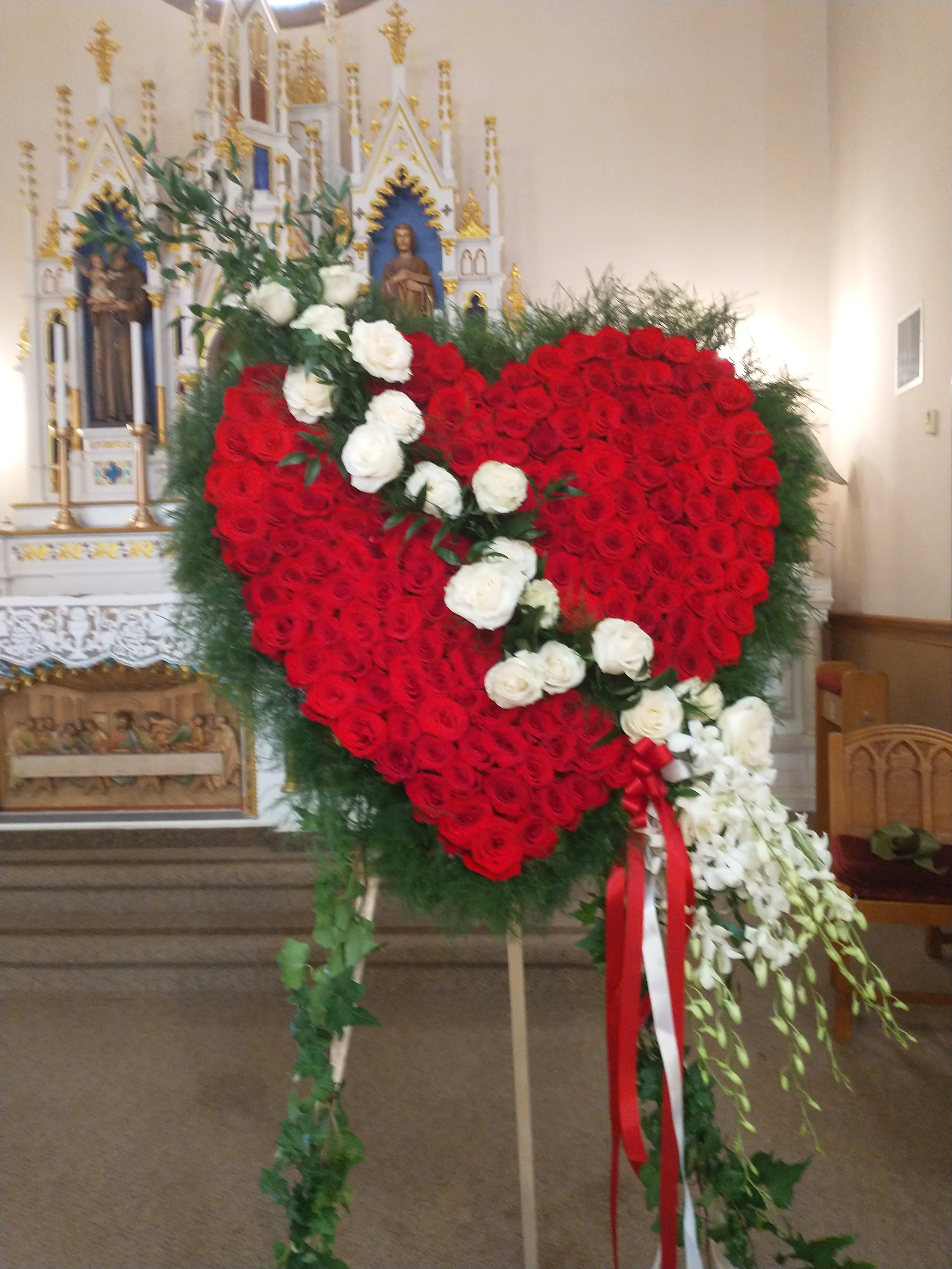 Red broken heart 2 days notice - Large heart lovely red roses, white with a cluster of white orchids.  Please order   In advance. Can be made out of any color rose you desire.