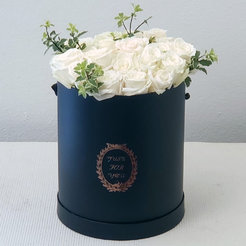  Simply White Roses Gift Roses - Roses in white color conveys a meaning of tranquility, genuineness, sincerity, gratitude, memory. It can be great for saying “thank you!" or a Wedding gift. These fresh-cut roses will be delivered in a medium gift box ready to be enjoyed.  Approximately: 12" H x 10" W.    Standard bouquet includes 20 stems.  Deluxe bouquet includes 30 stems.  Premium bouquet includes 40 stems