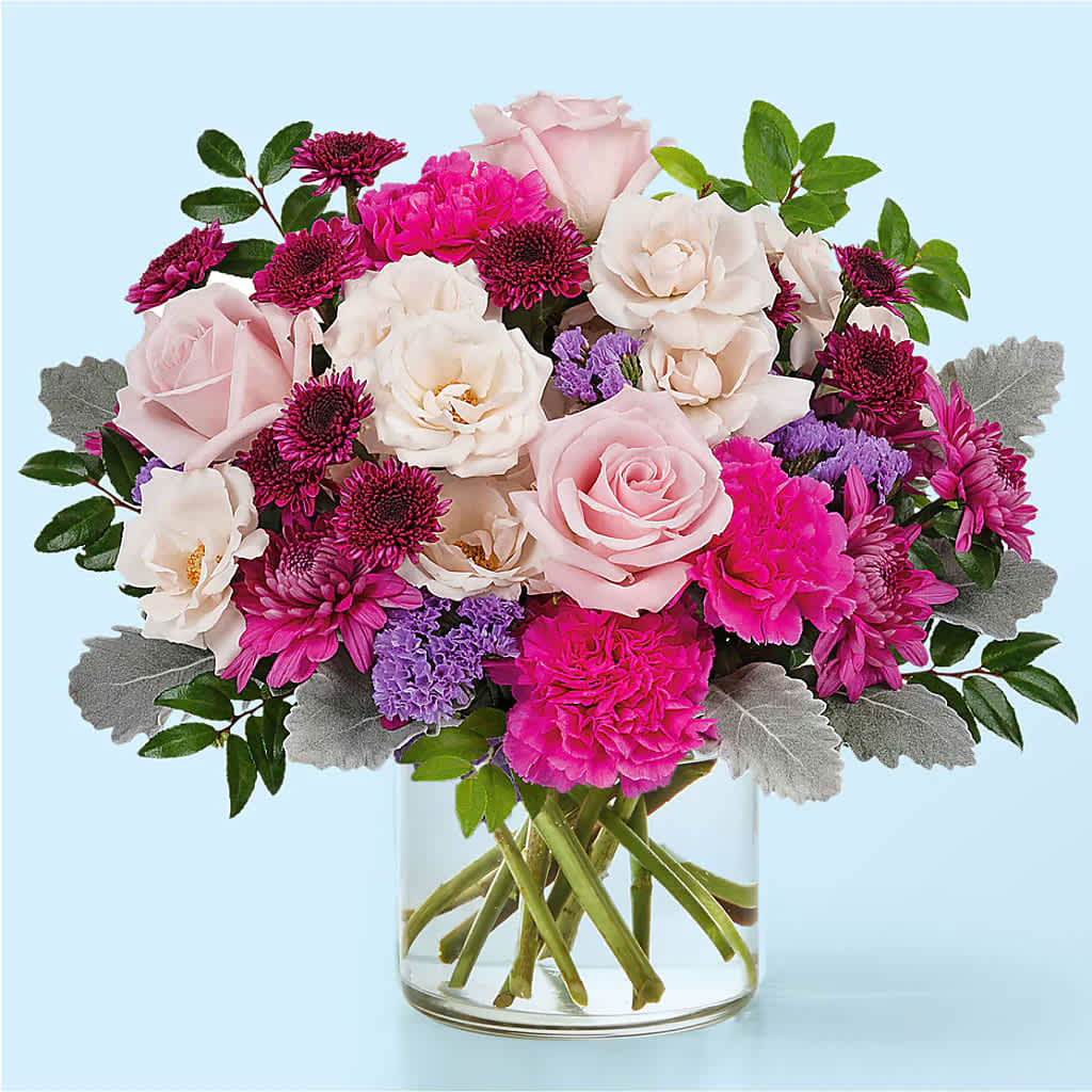 Girls' Night Out Bouquet - Bring that perfect GNO energy to any day with this vibrant, cheerful arrangement featuring pink roses, cream spray roses, bright pink carnations, lavender statice, magenta and purple chrysanthemums, and dusty miller accents for a stylish, modern touch.  Approximately: 13" H x 12" W.  This colorful medley is ideal for birthdays, celebrations with friends, or simply to add a pop of joy to any room.