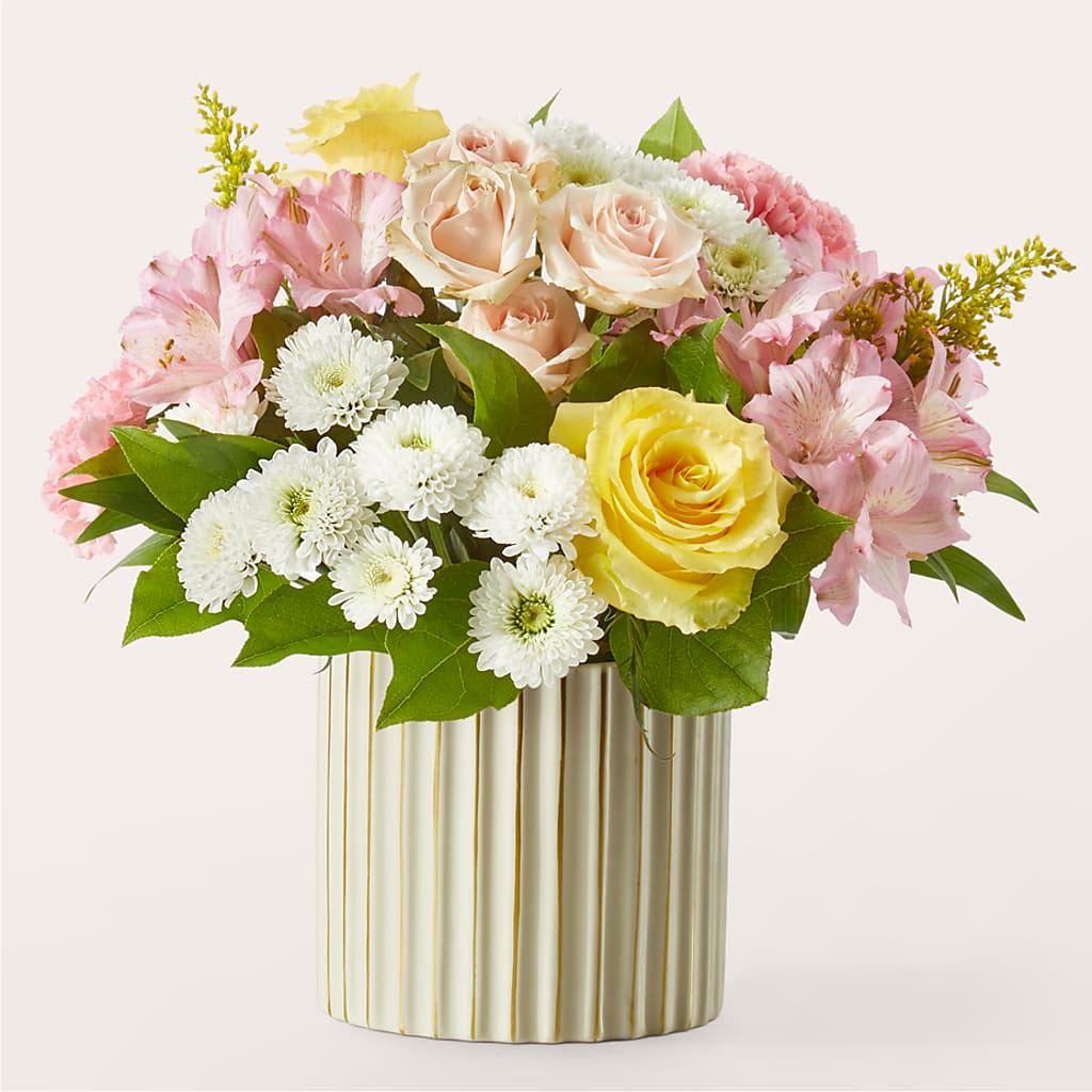 Watercolors Bouquet - Perfectly pleasant, a soft blend of pastel blooms makes for a lovely gift for an anniversary, moment of remembrance, birthday hugs, and so much more.  2 Pink Alstroemeria stems 2 White Button Pompon stems 2 Yellow 50 cm Roses 2 Pink Standard Carnations 1 Pink Spray Rose stem 1 Solidago stem 2 Salal tips