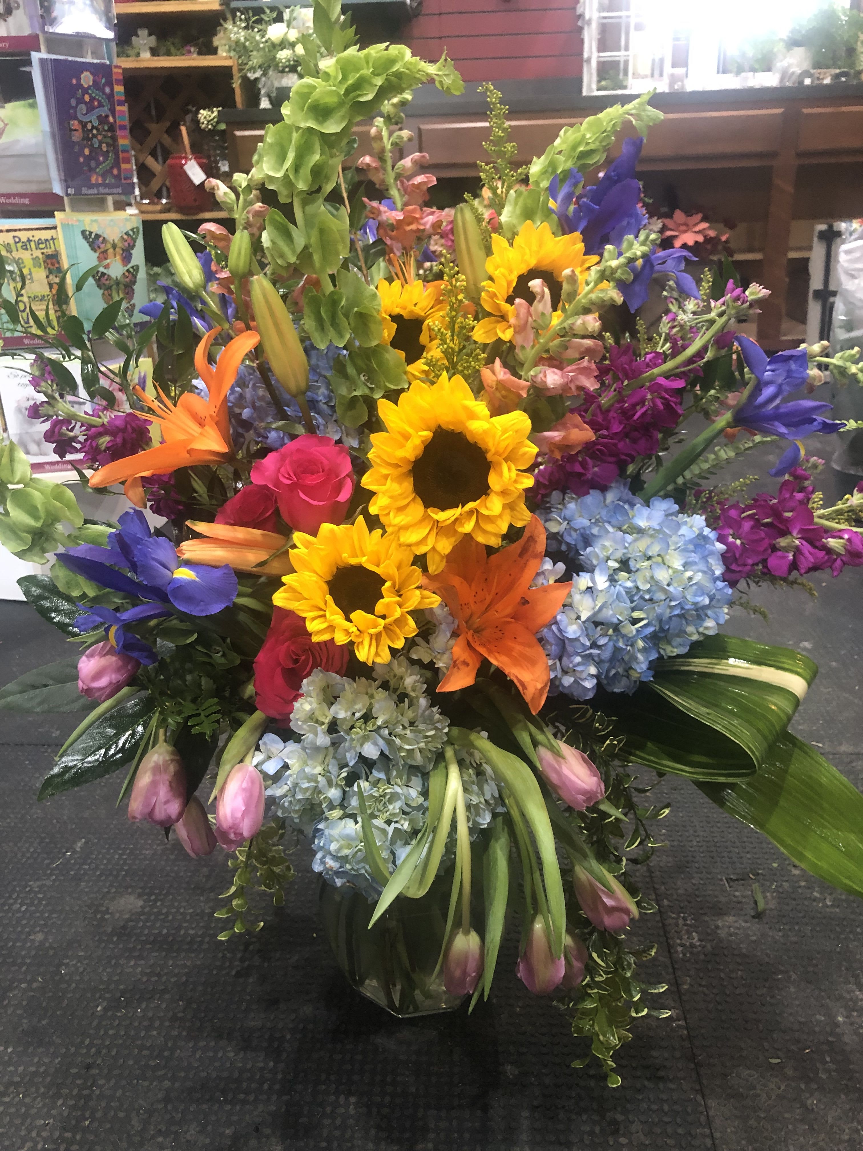 BRIGHT TIMES AHEAD - A bright funeral arrangement to remind those that even though dark times are here, there will be bright times ahead