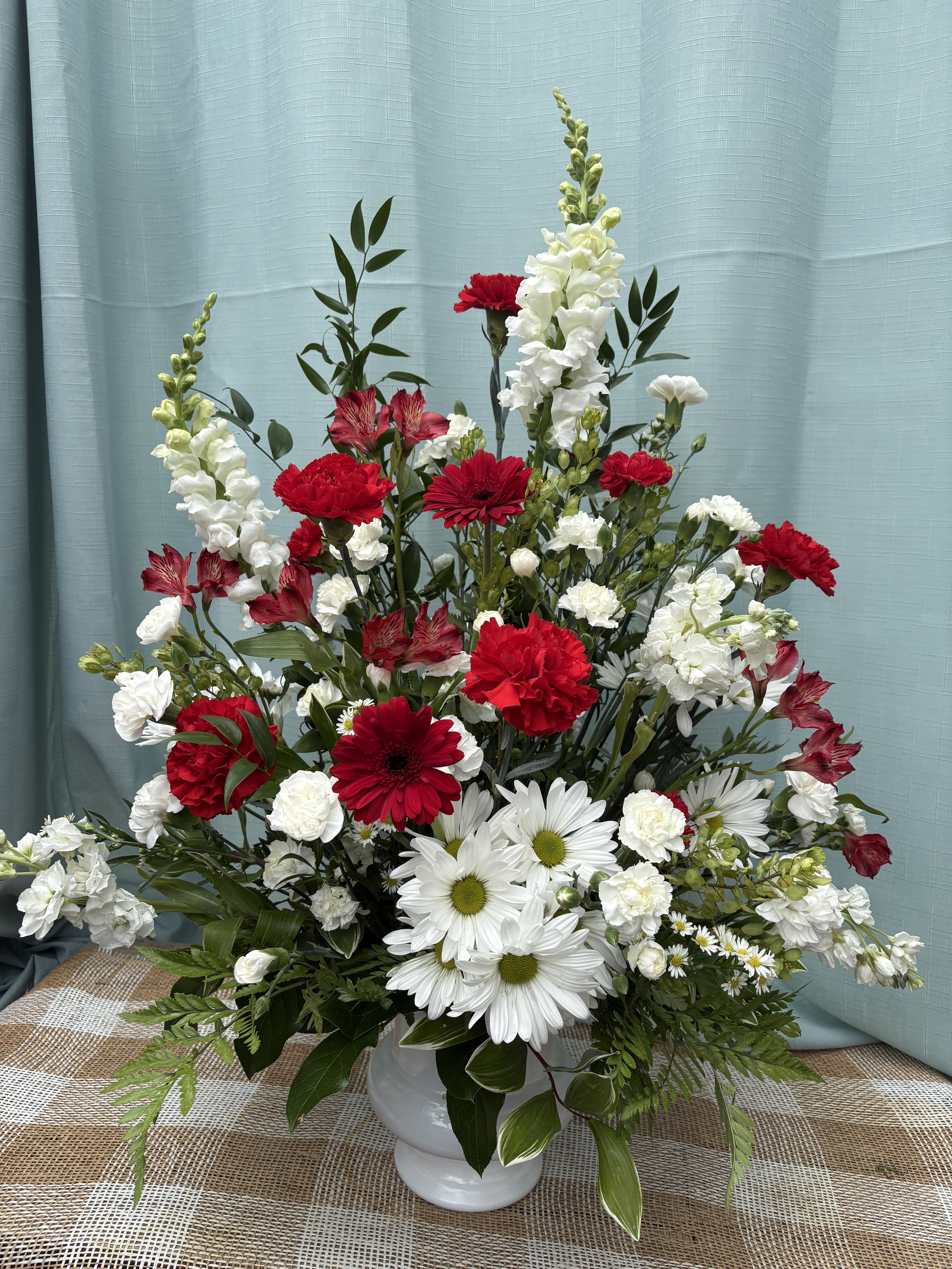 CLASSICALLY REMEMBERING - A classy funeral piece with classic whites and reds to remember the memories of passed loved ones