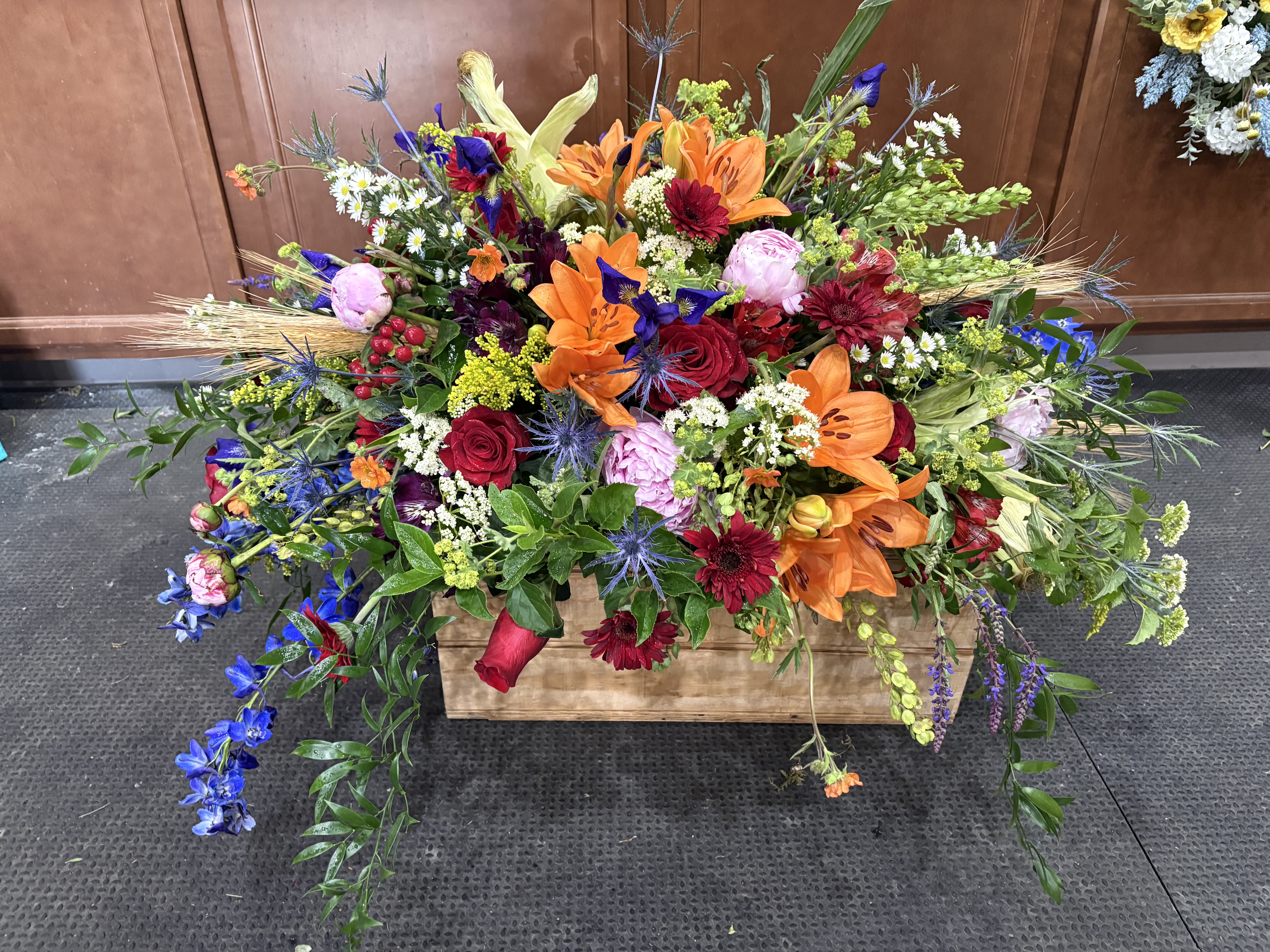 INFINITE BLESSINGS - A brightly colored funeral piece in box planter to show thanks for the infinite blessings passed loved ones have given 