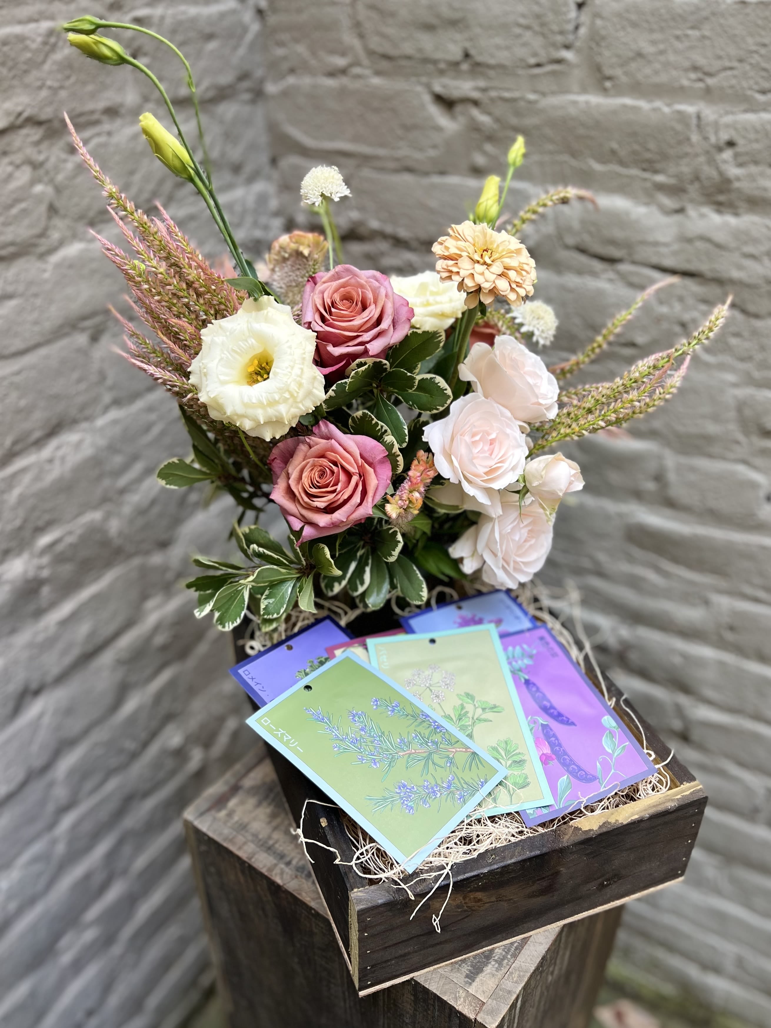 Gardener's Delight - A beautiful bounty of flowers for now... and later!  A handmade wooden box features a gorgeous flower arrangement of local flowers and other garden pretties, PLUS 6 Shido designer seed packets for planting in your own garden!  Arrangement measures approximately 16" tall x 13" wide.  