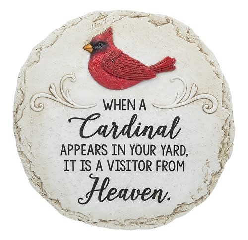 Round memorial stone with a red cardinal and text about heaven