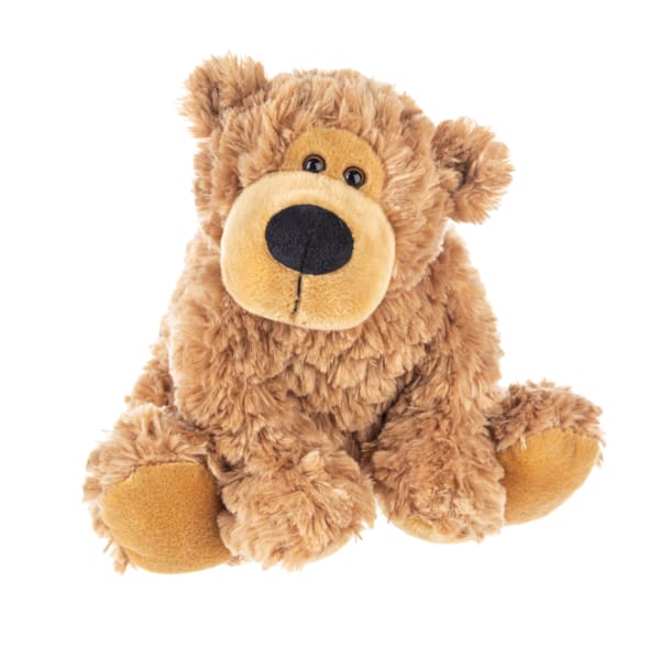 Plush teddy bear sitting on a white background