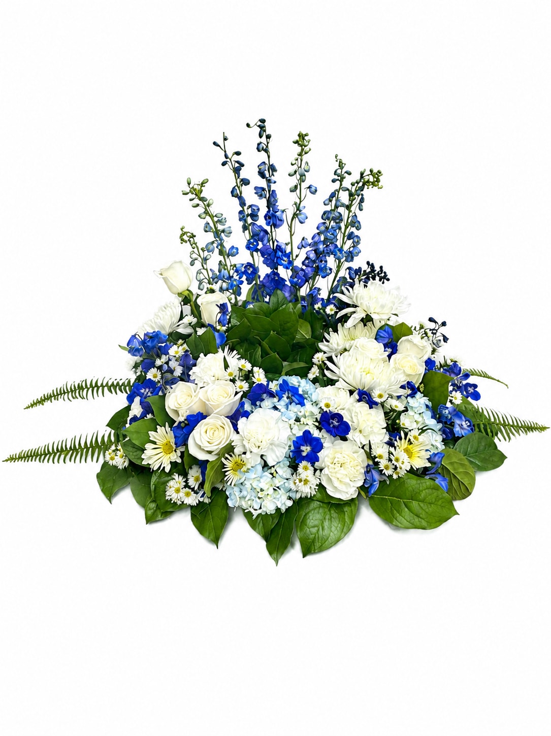 Blue and White Urn Wreath  - Beautiful round urn peace with blue delphinium, white roses and blue hydrangeas, white carnations, white mums, filler and greenery are ideal to grace a memorial service. 