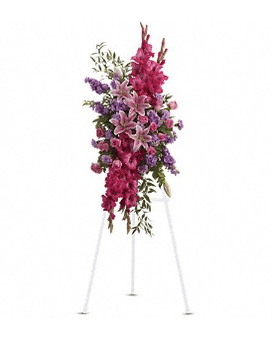 Tall pink and purple floral spray on a white easel